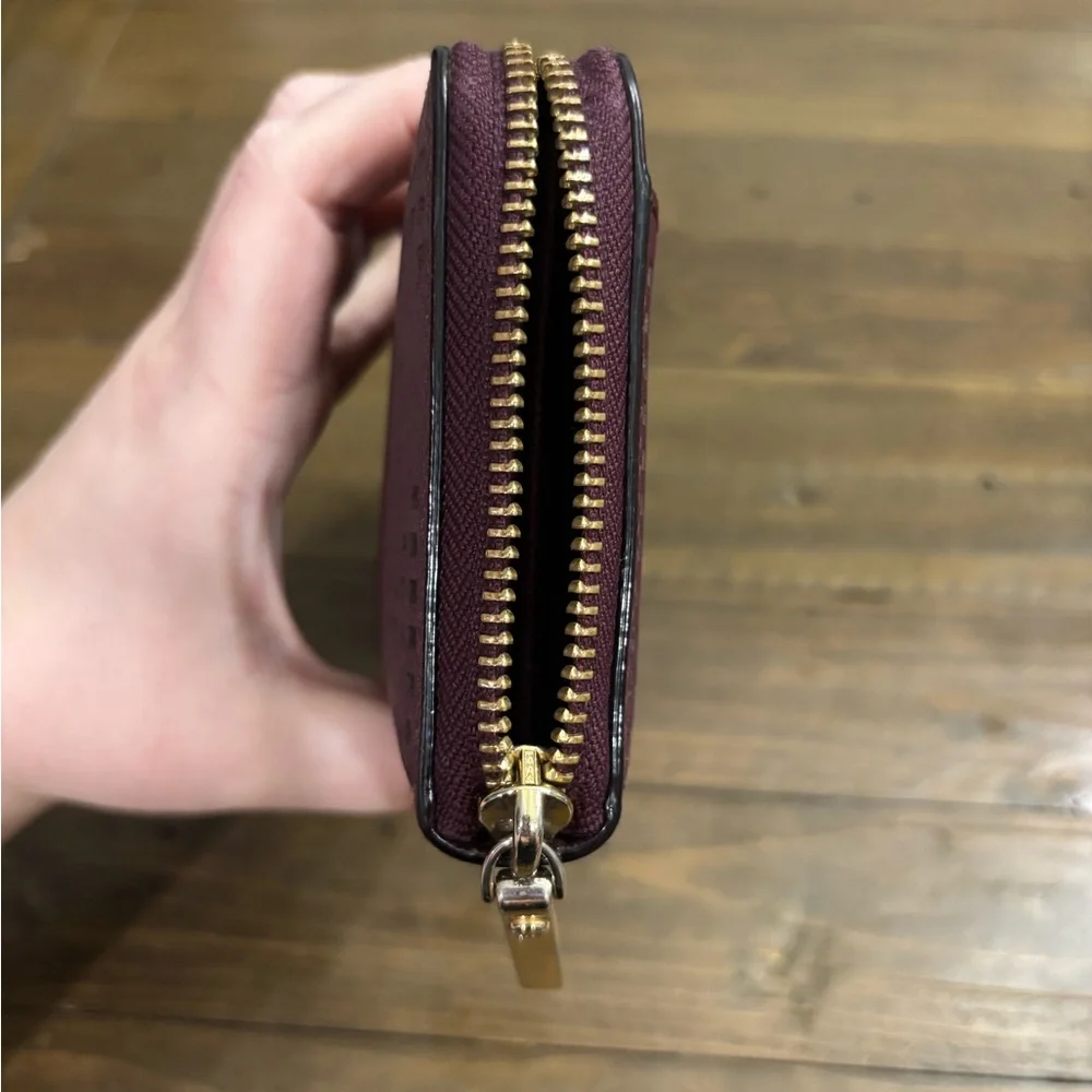 Kate Spade Cameron Street Perforated Rose Lacey Wallet in Deep Plum